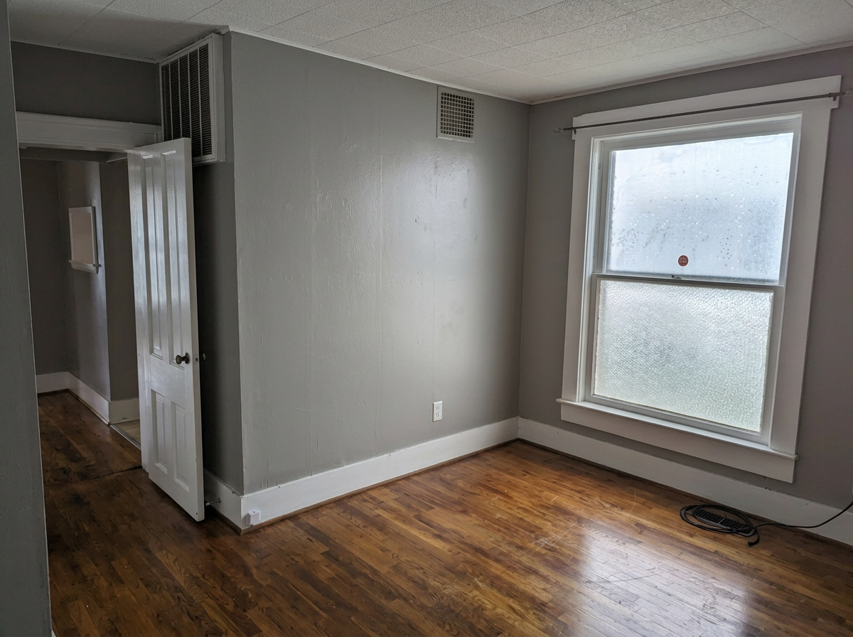 Downstairs bedroom with large window